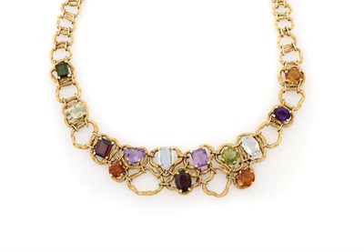 Lot 371 - A Multi Gemstone Necklace, textured gold in asymmetric loops set with varied cut gemstones...