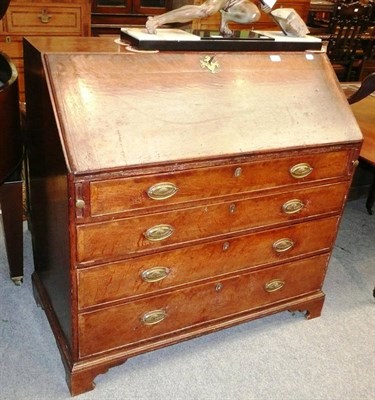 Lot 518 - George III oak bureau with fitted interior