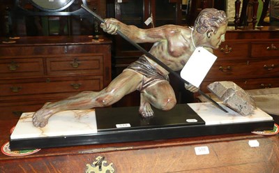 Lot 519 - Art Deco spelter male figure pushing a rock, on a marble base