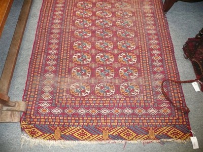 Lot 545 - Afghan wedding camel trapping; a flat-weave bag; and a Lahore Turkman rug (3)