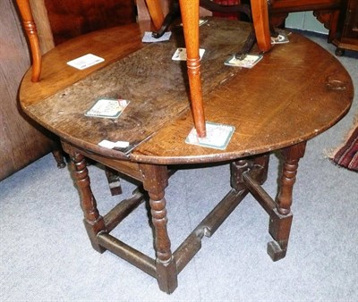 Lot 551 - Small 18th century oak gateleg table, a bookcase with books and a dressing mirror