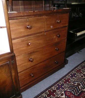 Lot 553 - A 19th century mahogany chest of two short over three long graduated drawers, on platform base,...