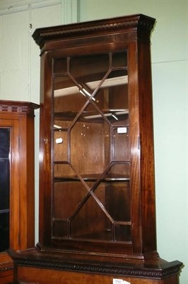 Lot 557 - Mahogany corner cupboard