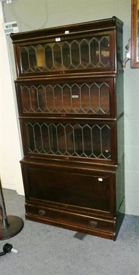 Lot 570 - A Globe Wernicke style four-tier stacking bookcase, with leaded glazed dust covers, 87cm wide