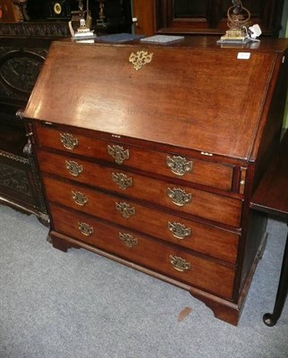 Lot 573 - George III oak bureau