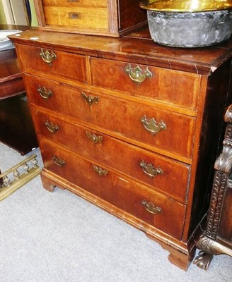 Lot 575 - An early 18th century walnut veneered chest of two short over three long graduated drawers, on...