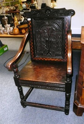 Lot 590 - A Joined Oak Armchair, circa 1700, the carved top rail above a herringbone inlaid back support...