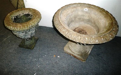 Lot 602 - A reconstituted stone shallow pedestal urn and another, smaller