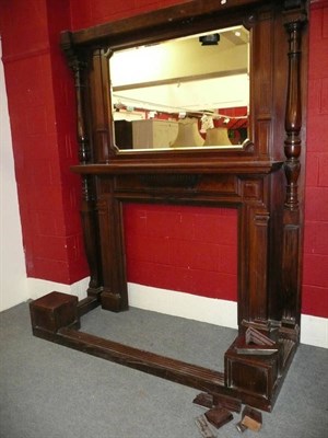 Lot 615 - A carved mahogany fireplace