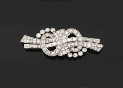 Lot 384 - An Art Deco Diamond Double Clip Brooch, of round brilliant and baguette cut diamonds, total diamond