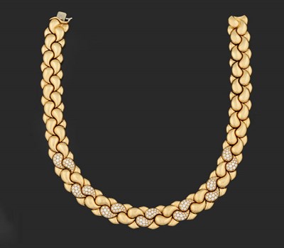 Lot 395 - An 18 Carat Gold Diamond Necklace, by Chopard, intertwined gold teardrop shapes with seven pairs of