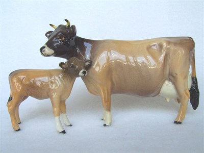 Lot 1068 - Beswick Jersey Cow Ch. 'Newton Tinkle', model No. 1345, 10.8cm high and Jersey Calf, model No....