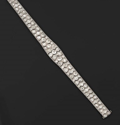 Lot 400 - A Diamond Bracelet, the old cut diamonds from a wide central panel graduate to the back in...