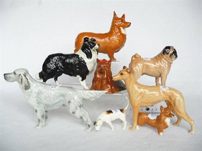 Lot 1086 - Eight Beswick Dogs, Greyhound 'Jovial Roger', large Pug 'Cutmil Cutie', English Setter...