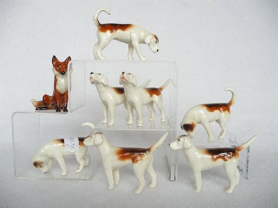 Lot 1091 - Seven Beswick Foxhounds, models 941 x 2; 942 x 2; 943 x 2; 944 x 1 and Beswick Fox, seated,...