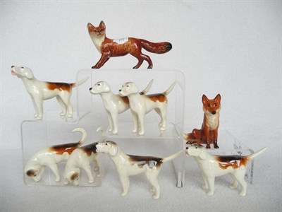 Lot 1092 - Seven Beswick Foxhounds, first version models 941 x 3; 942 x 2; 943 x 2 and Two Beswick Foxes,...