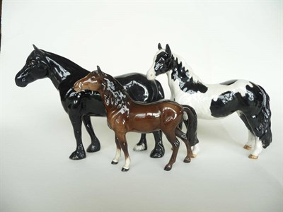 Lot 1104 - Three Beswick Ponies, Dales Pony 'Maisie', model No. 1671, black gloss, 16.5cm high (ear repaired)