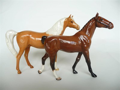 Lot 1112 - Beswick Palomino Arab Horse, model No.1265 (Xayal shape), gloss, 15.9cm high and a Beswick Bay...