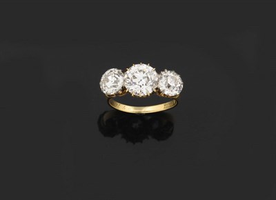 Lot 405 - A Diamond Three Stone Ring, circa 1910, the graduated old brilliant cut diamonds held in yellow...