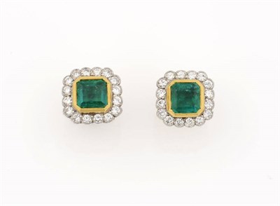 Lot 406 - A Pair of 18 Carat Gold Emerald and Diamond Cluster Earrings, the emerald-cut emeralds in a rubover