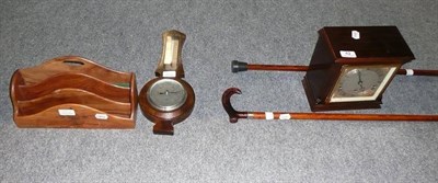 Lot 42 - A Boodle and Dunthorne mantel clock, letter rack, barometer and a pair of walking sticks
