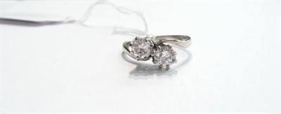 Lot 81 - A diamond two stone twist ring
