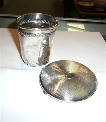Lot 94 - A silver circular compact and a French silver beaker