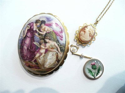 Lot 101 - A seed pearl and thistle motif pendant, a cameo locket on chain and a porcelain brooch stamped...