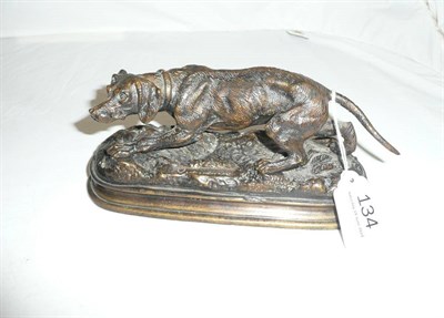 Lot 134 - Cast bronze of a working dog, signed