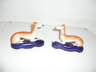 Lot 136 - A pair of Staffordshire greyhound inkwells