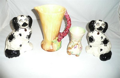 Lot 148 - Pair of Staffordshire spaniel dogs and two Clarice Cliff vases