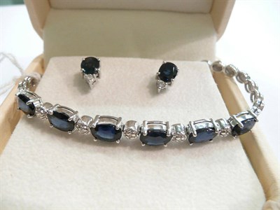 Lot 192 - Sapphire and diamond white gold bracelet and earrings