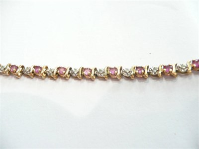 Lot 198 - A 9ct gold diamond-set line bracelet