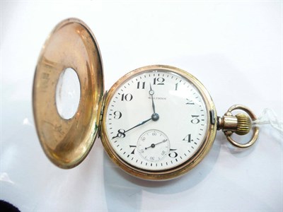 Lot 210 - A Waltham 9ct gold half hunter top wind pocket watch