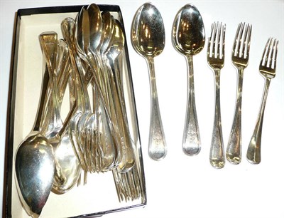 Lot 221 - Eleven dessert spoons, eleven forks, a Christening spoon and fork