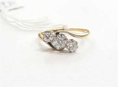 Lot 223 - A diamond three stone twist ring