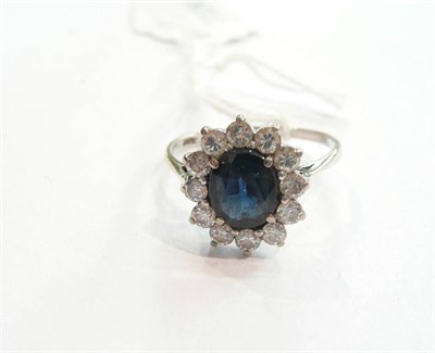 Lot 235 - A sapphire and diamond cluster ring