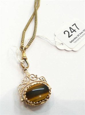 Lot 247 - Tiger's eye gold-framed fob on plated chain