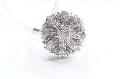 Lot 251 - A diamond cluster ring set with old cut diamonds