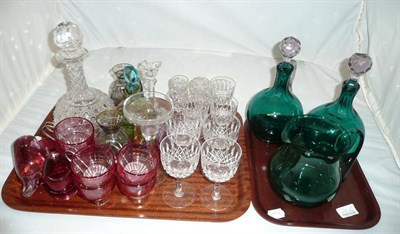 Lot 290 - Tray of cut and coloured glass ware, pair of green glass decanters and a green jug