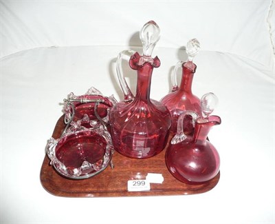 Lot 299 - Pair of cranberry dishes in plated stand and three decanters