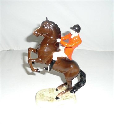 Lot 315 - Beswick Huntsman on Rearing Brown Horse, model No. 868 (style two), gloss, 25.4cm high (af)