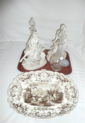 Lot 321 - Two bisque figures, a pair of decanters and a Wedgwood Pomerania pattern meat dish