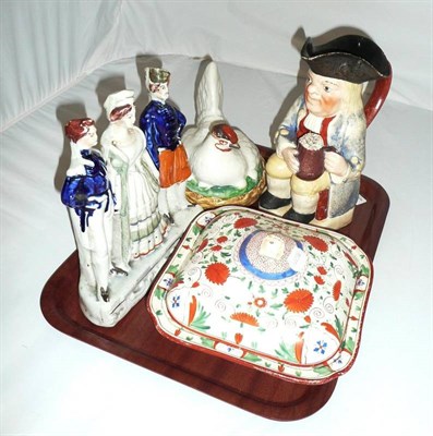 Lot 328 - 19th century Toby jug, Staffordshire triple figure, egg basket and 19th century tureen and cover