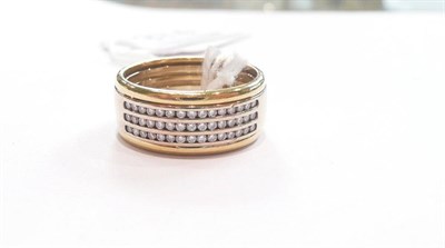 Lot 374 - An 18ct gold three row diamond ring