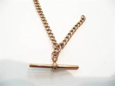 Lot 376 - A rose gold graduated curb Albert hung with t-bar 30.5g approximately