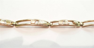 Lot 387 - A three colour gold sliding bracelet stamped 585