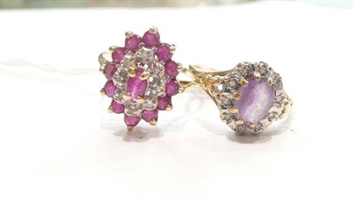 Lot 392 - An amethyst diamond cluster ring and a ruby diamond cluster ring (2)