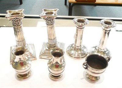 Lot 398 - A pair of silver Corinthian column candlesticks, another pair, etc