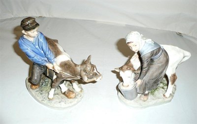 Lot 402 - Two Royal Copenhagen figures, a boy with a calf, no 772 and a girl feeding a calf, no 779